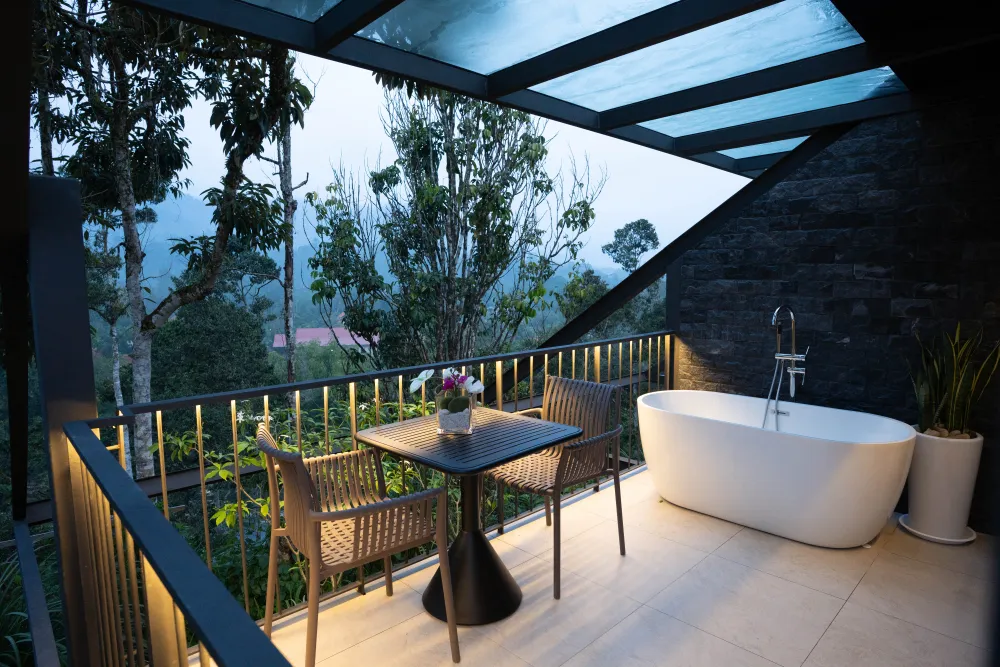 Estate lounge deck at dusk in the hills of Janda Baik