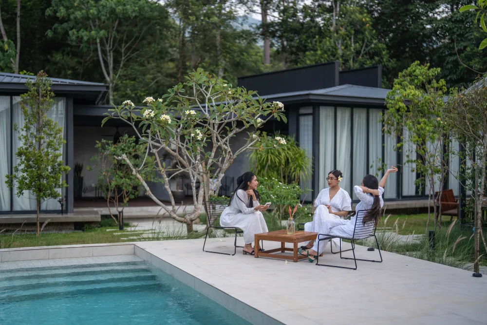 Guests gathered by the pool