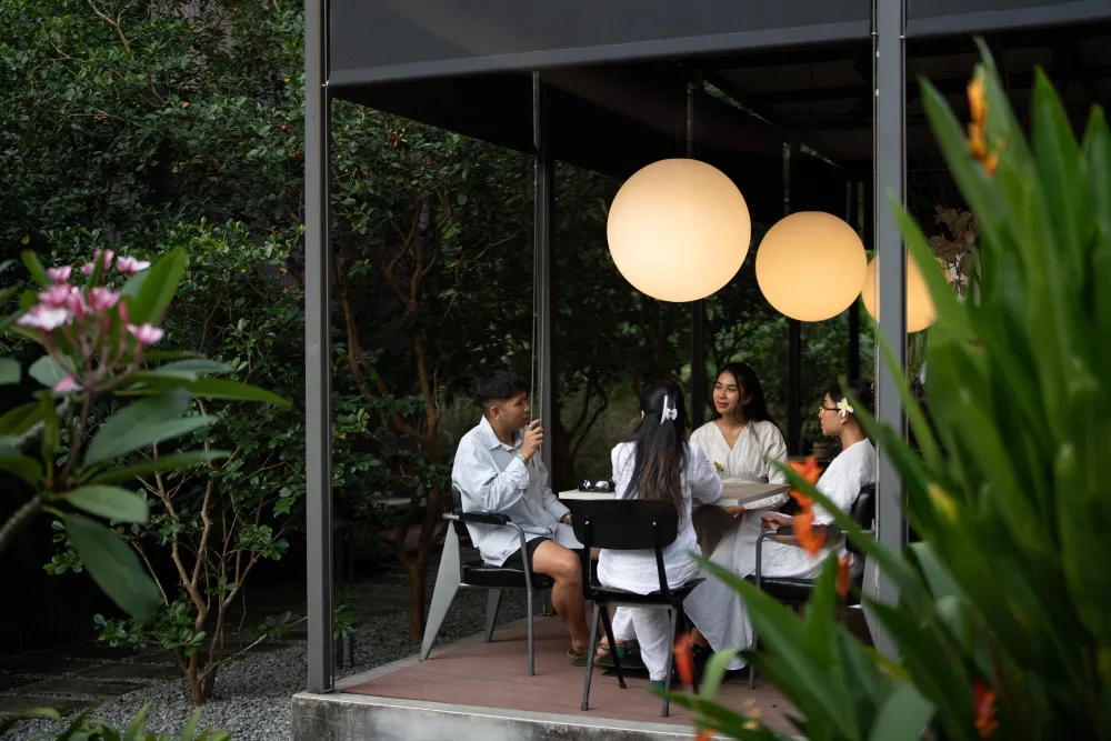 Guests dining under the pavilion at night